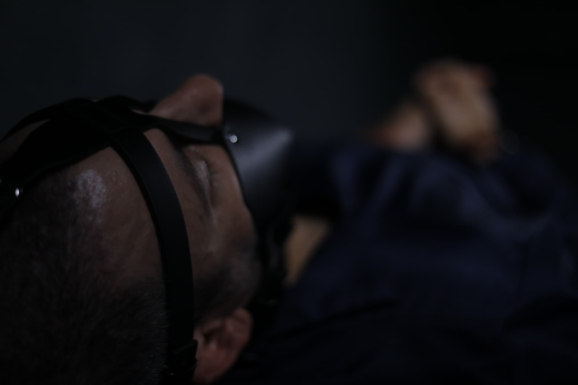 Harnessed and held — production still.