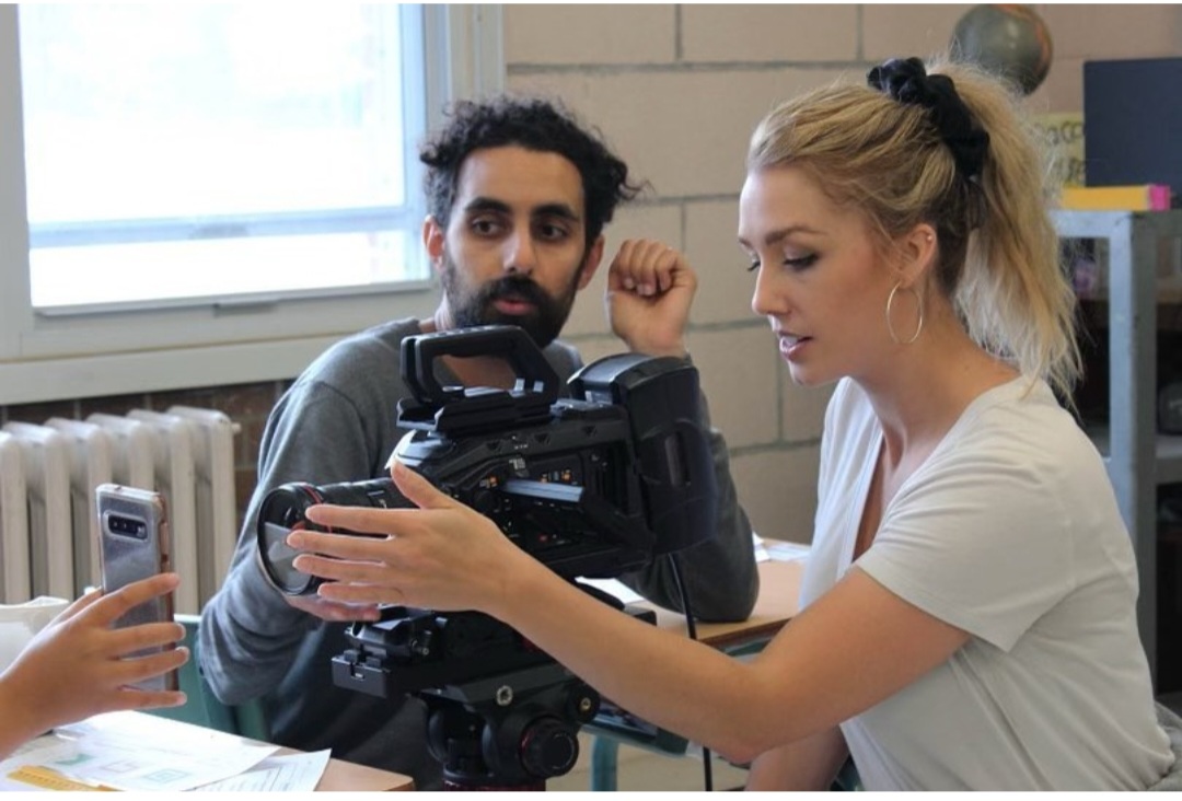 Setting the camera with the DOP on Portrait of Consumption.