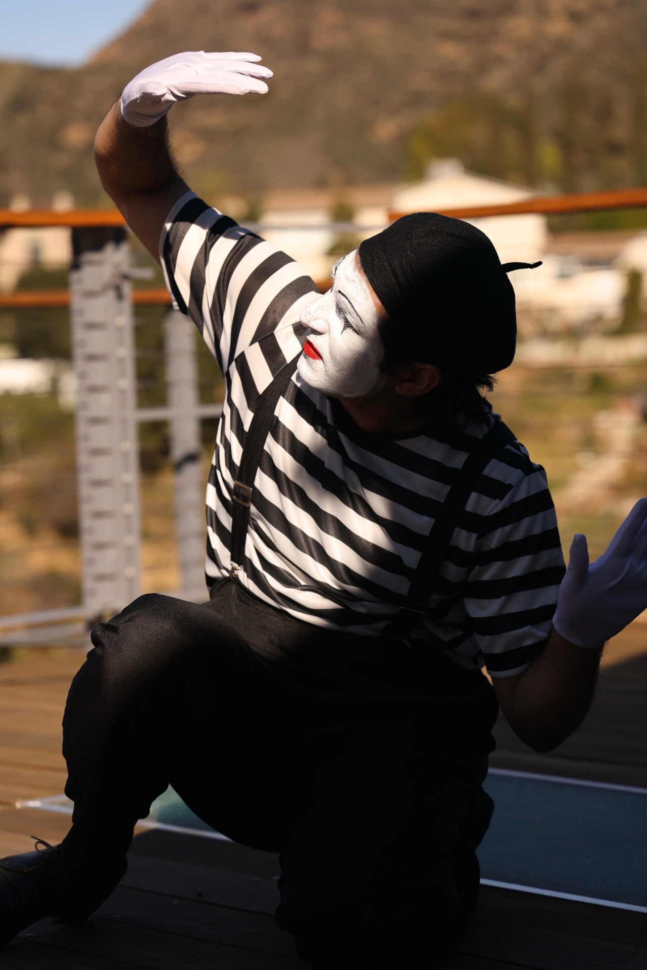 The performer in white face — Portrait of Consumption.