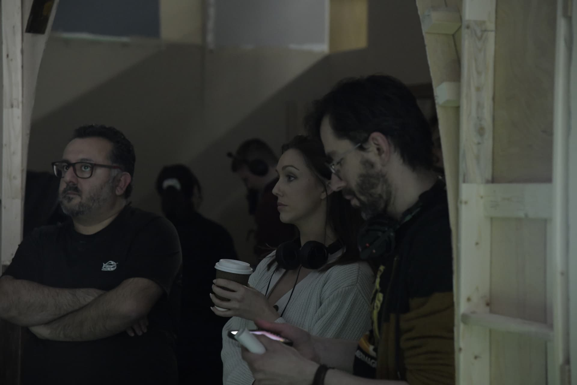 Crew watching the take from the wings.